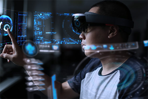 Young man using hololens to play in virtual reality