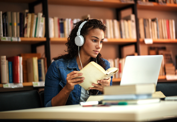 Young Woman Using Checklists for Online Learning - Student Success