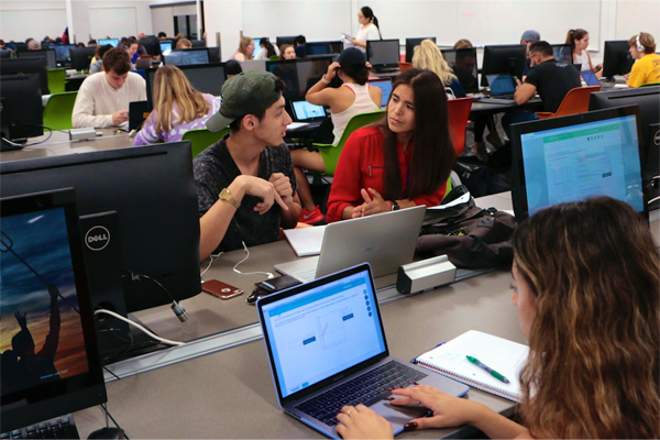 Lecturer Raquel Lopez Assisting Students