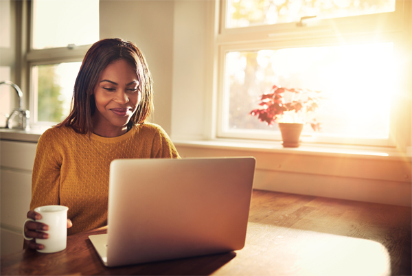 Community College Student Working Online at Laptop